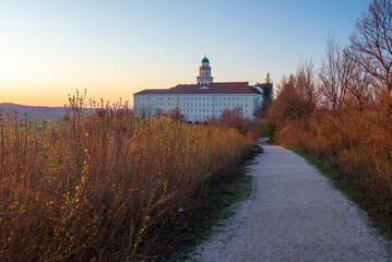 Pannonhalma Archabbey with the walking path at the sunset time
