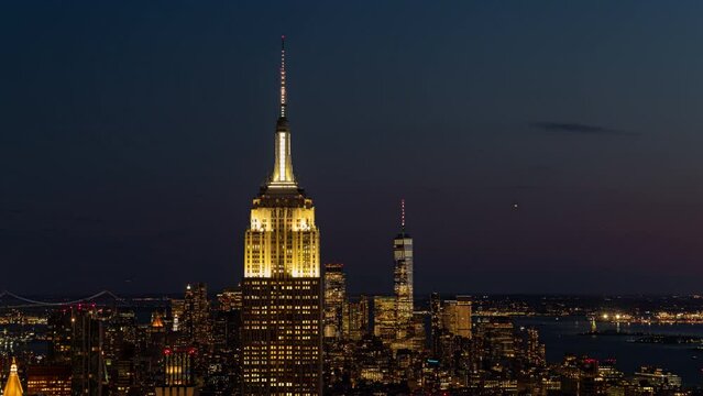 Night view of the skyline of New York, USA with the Empire State Building and One World Trade Center behind. 