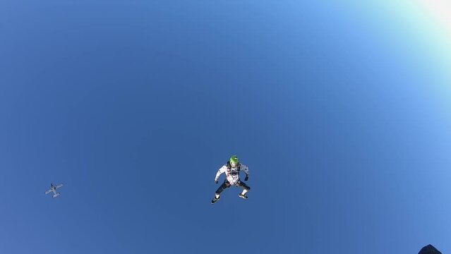 skydiving, acrobatics in the sky, a group of parachutists falling next to each other