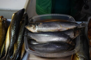 Almaty, Kazakhstan - 03.25.2022 : Selected pieces of fish are put up for sale in an open market.