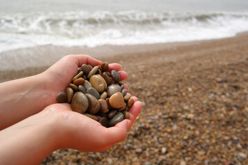 It is a stone that has been cut into a round pebble shape as the rock has been broken and eroded by...