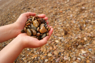 It is a stone that has been cut into a round pebble shape as the rock has been broken and eroded by...