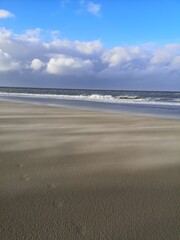 Fototapeta na wymiar Sandstorm on the beach of Texel, the Netherlands.