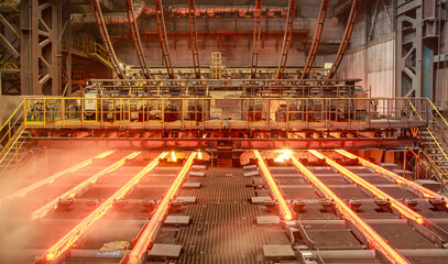 Hot billets in continuous casting machine.