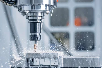 Foto auf Acrylglas Working closeup CNC turning cutting metal Industry machine iron tools with splash water © Parilov