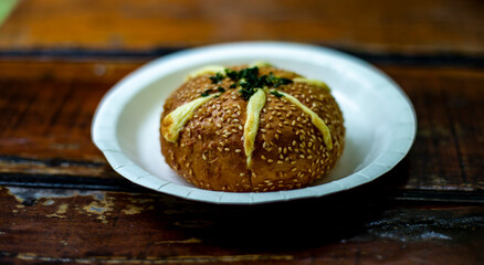 Cream Cheese Garlic Bread on white plate on wooden table