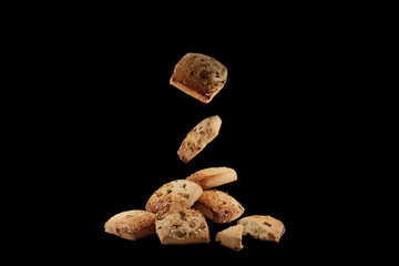 Freshly baked chocolate chips cookies isolated on black background. macro. close up.