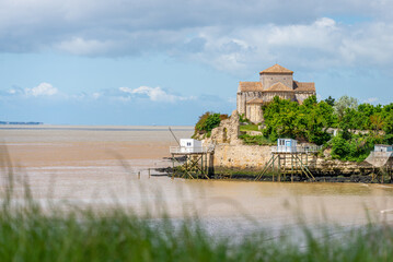 Church on rock outcrop of Gironde estuary on Atlantic coast of Charente-Maritime, France 
