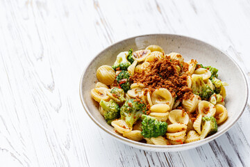 orequette pasta with broccoli on a white background