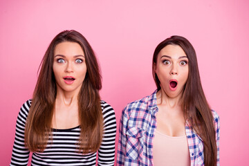 Portrait of astonished impressed girls open mouth look camera isolated on pink color background