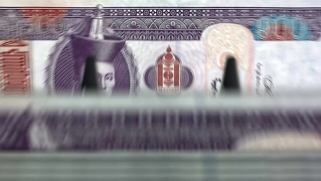 Mongolia Togrog, Tugrik money counting machine with banknotes. Quick MNT currency note down rotation. Business and economy. Concept loopable and seamless background.