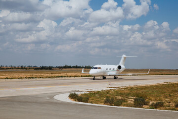 Fototapeta na wymiar White plane on the runway. Evacuation of the population