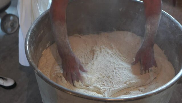 Baker kneading dough