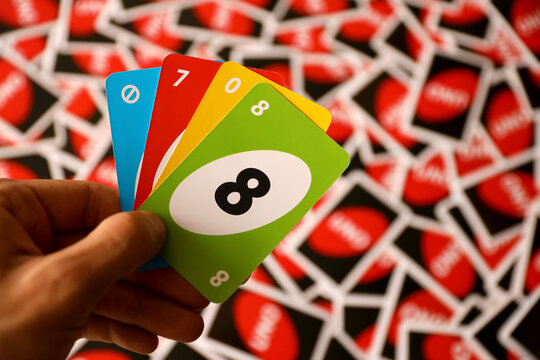 TERNOPIL, UKRAINE - MAY 15, 2022: Many colorful UNO game cards. UNO is an American shedding-type card game that is played with a specially printed deck