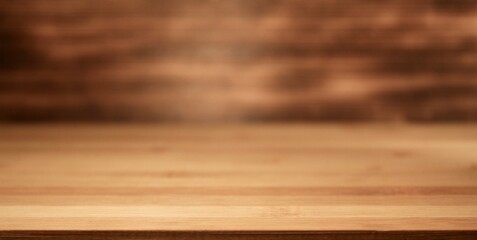 Bokeh wooden backdrop in a perspective view. focused bottom front view of a wooden backdrop mockup for products or food items advertising and editing.