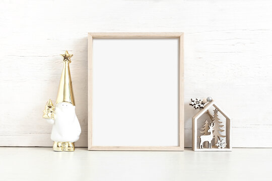 Vertical wooden frame mockup with christmas attributes.