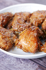  slice of a BBQ chicken from a plate 