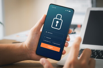 Cybersecurity internet and networking concept. Close up of hand holding smartphone information security and encryption, secure access to user's personal information, secure Internet access.