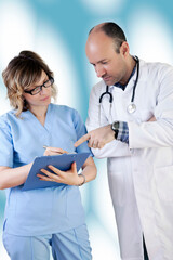 Doctor and Nurse are Diagnosing a Case Againt Blue Background