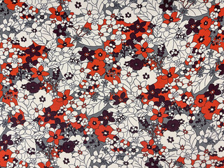 The white and orange color flowers pattern on fabric
