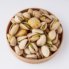 fresh salted pistachios on a white background