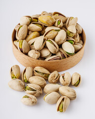 fresh salted pistachios on a white background