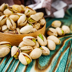 fresh salted pistachios on a wooden rustic background