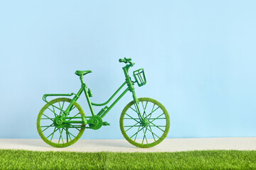 Obraz premium World Bicycle Day. Green bicycle and world. Environment preserve.