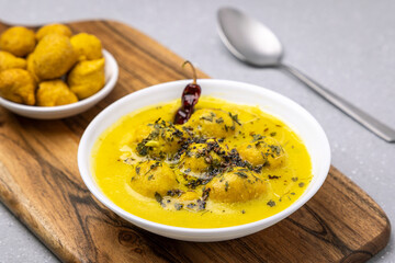 Kadhi Pakora, a Punjabi cuisine made with fritters dipped in curd based curry with gram flour and spices