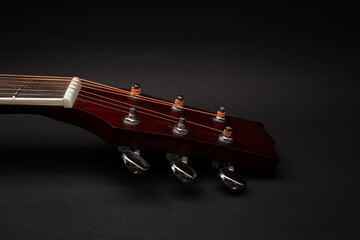 Guitar details on black background