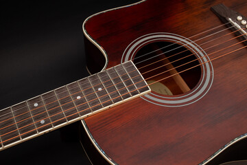 Guitar details on black background