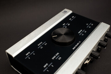 Audio mixer on a black background, a subject shot of musical instruments