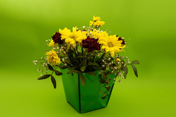 Bouquet of flowers on a green background