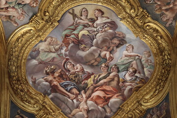 Fototapeta premium Santi Ambrogio e Carlo al Corso Basilica Ceiling Fresco with Heavenly Scene with Various People and a Dog in Rome, Italy