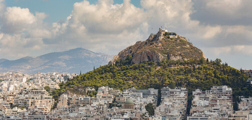  cityscape of Athens and Lycabettus hill taken from the acropolis buildings and distance mountains