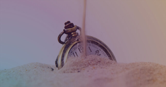 Image of clock over sand and timer - Powered by Adobe