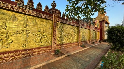 18 April 2022, Goldend wall with Khmer Empire concept at  Wat Taing Kork, Kampong Thom Province, 50's architecture. Located Tang Kork District, Kampong Thom Province, Cambodia.