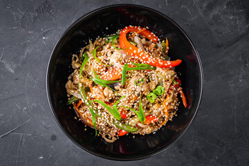 delicious chinese fried noodles on a black background