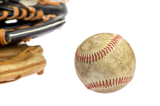 baseball ball and vintage classic leather baseball glove isolated on white background.