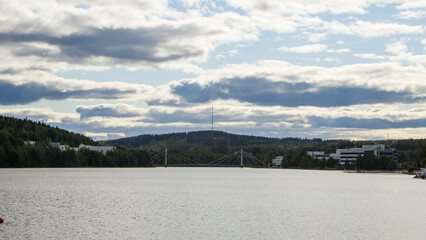 Obraz premium Finnish landscape lake and forest hills and bridge Jyväskylä, Finland.