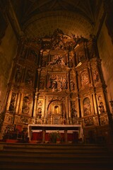 Baroque main altar at Santa María de la Asunción church depicting the Assumption of Mary and...