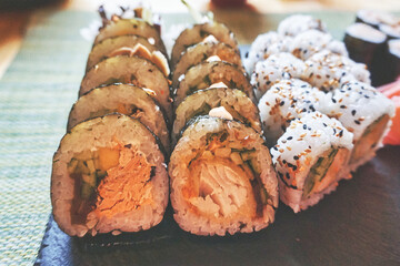Sliced rolls of salmon sushi - set