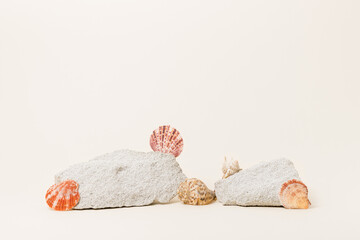 Blank summer stone podiums with seashells for cosmetic and product presentation