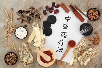 Chinese herbal plant medicine with acupuncture needles, herbs, spice with calligraphy script on...