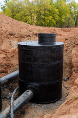 Water utility pipeline, black well made of concrete, waterproofing with paint, protective...
