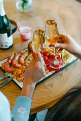 celebratory dinner with glasses of pink champagne