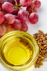grape seed essential oil on a white background