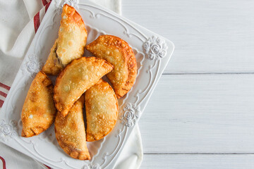 Fried chebureks, close-up, on a light background, no people,