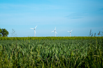 Wind Turbines Windmill Energy Farm generating electricity. Eco power. Wind farm. Renewable energy resources. Wind turbine field in Germany.