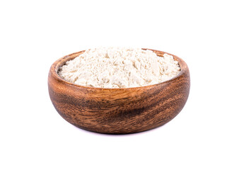 Wooden bowl with flour on a white background.